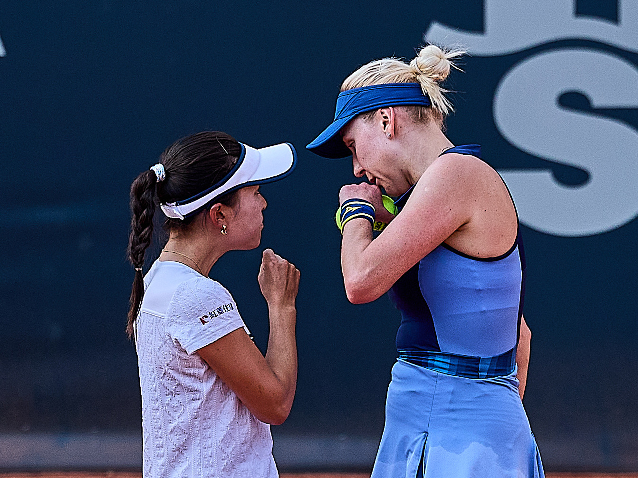 Only write the title, nothing else. Kitchunock & Ninomiya Fall Short Against Paris 2024 Gold Medalists in Madrid Open First Round – Tennis Magazine